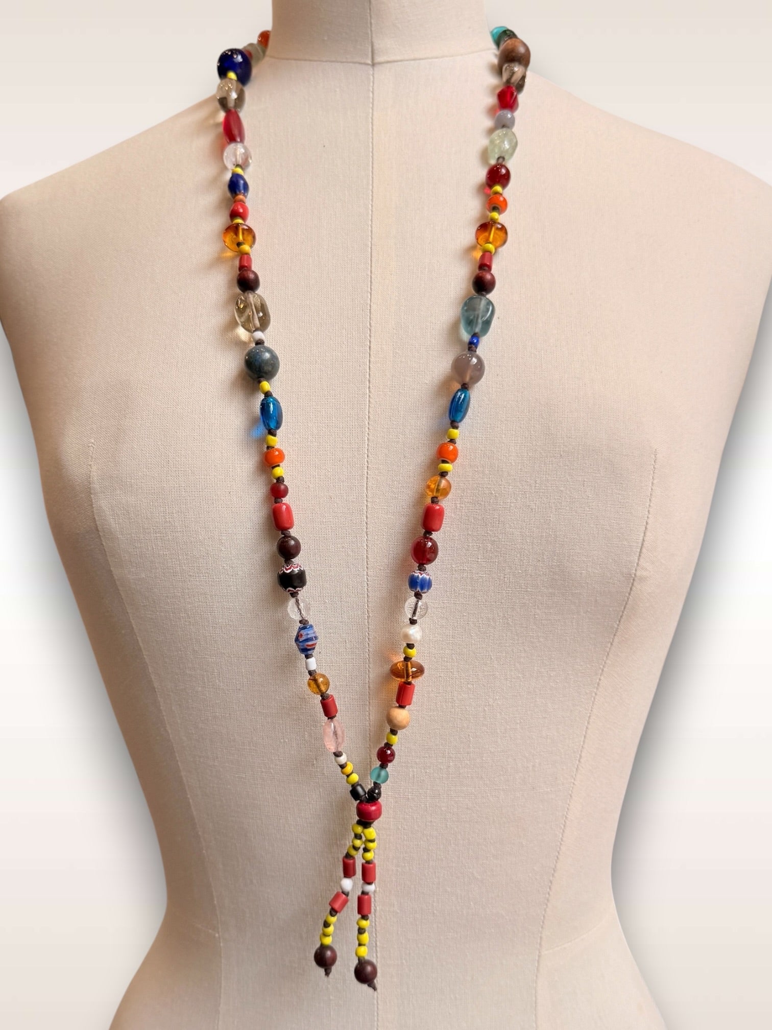 Mixed bead necklace w/ yellow & orange tails