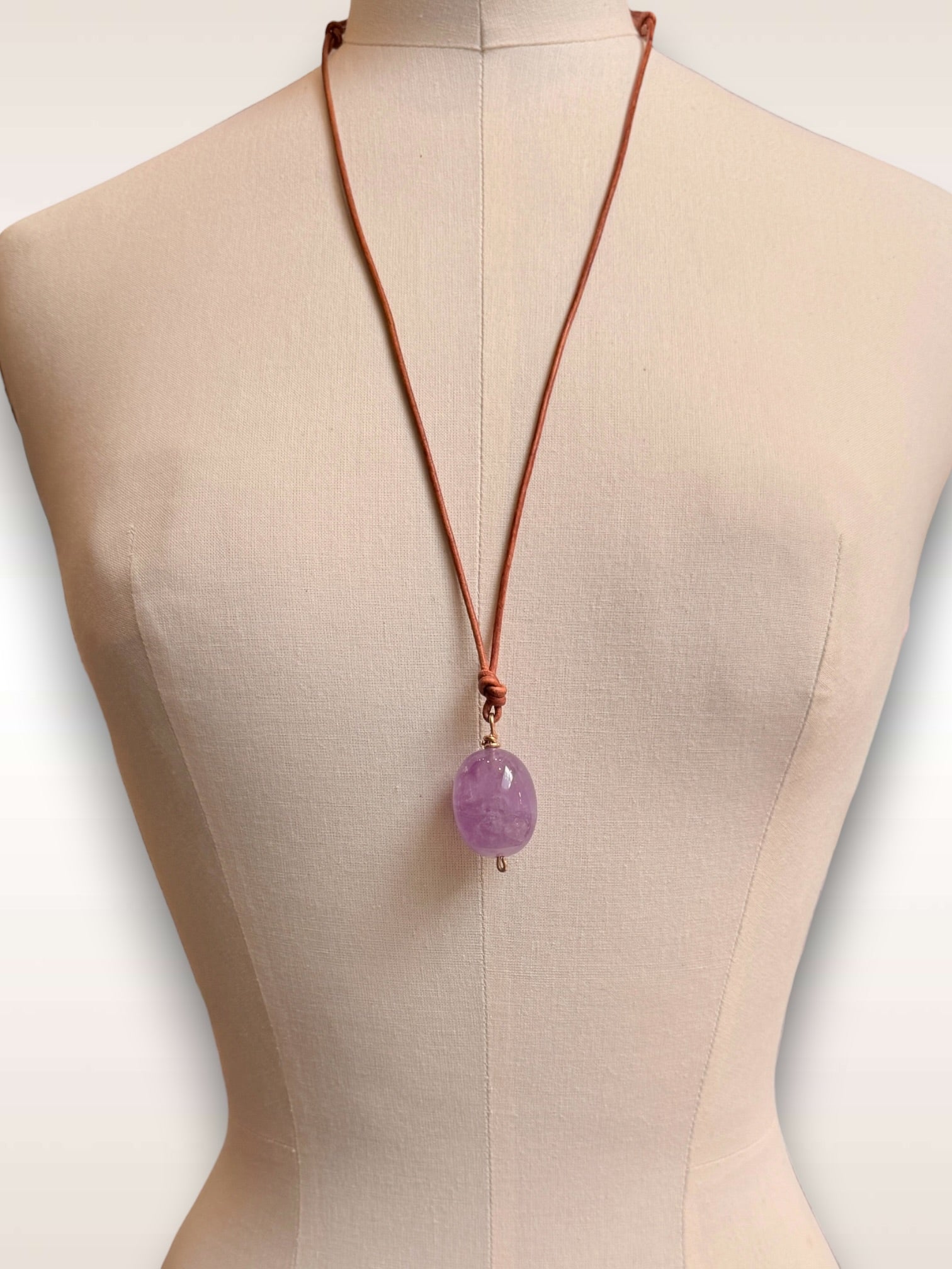 Amethyst & bronze post on leather cord