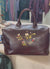 Hand painted leather bag by Marie Clare